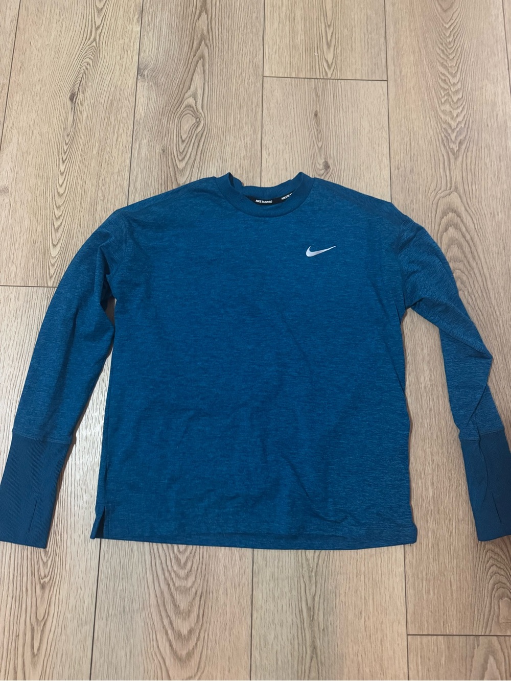 Nike women’s Long-Sleeve Crew in Teal Blue with Swoosh